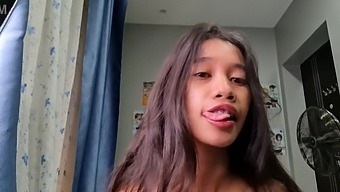 A Petite Asian Girl With A Slender Physique